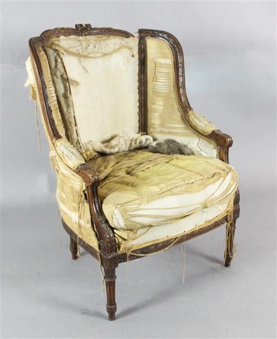 A Louis XVI style walnut bergère, late 19th century,